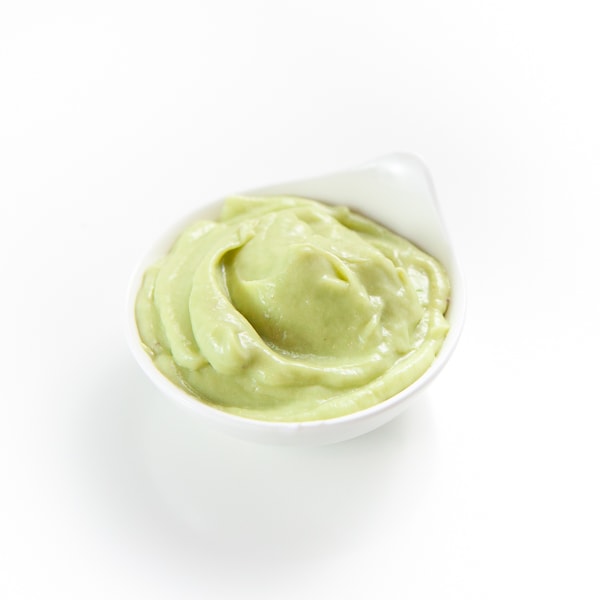 Small white bowl of pureed avocado puree