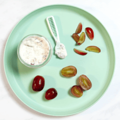 Teal baby plate with grapes, cut and served in different ways for different ages and stages of baby