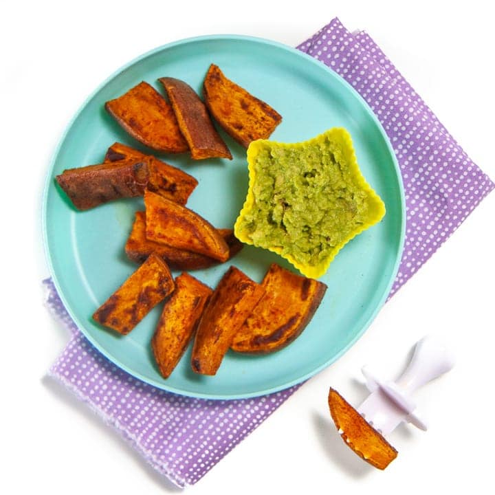 Teal plate with sweet potato wedges for baby.