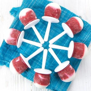 popsicles fanned out on a blue napkin.