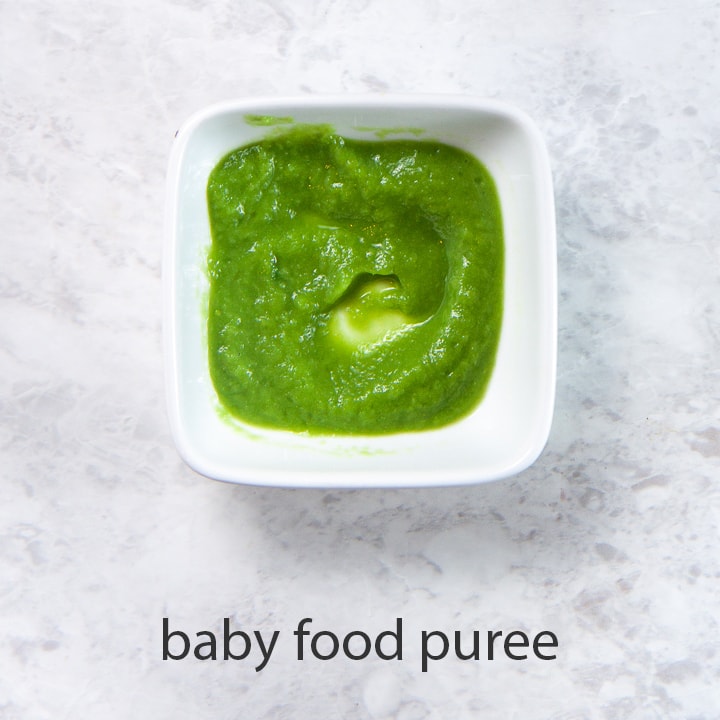 bowl of green bean puree for baby first food.