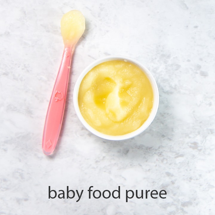 bowl of apple baby food puree - great for one of baby's first foods.