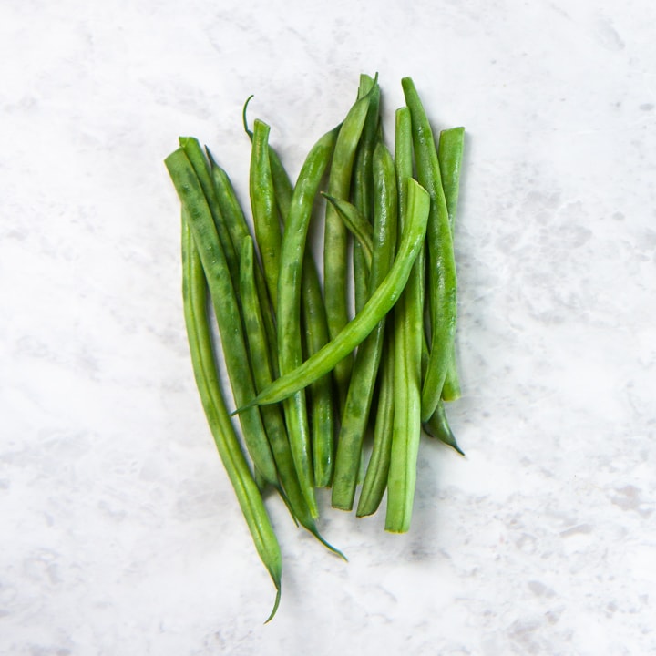 Pile of green beans are ready for baby's first foods.