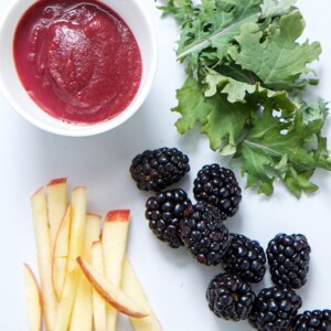 Spread of produce and a small bowl of baby food puree.