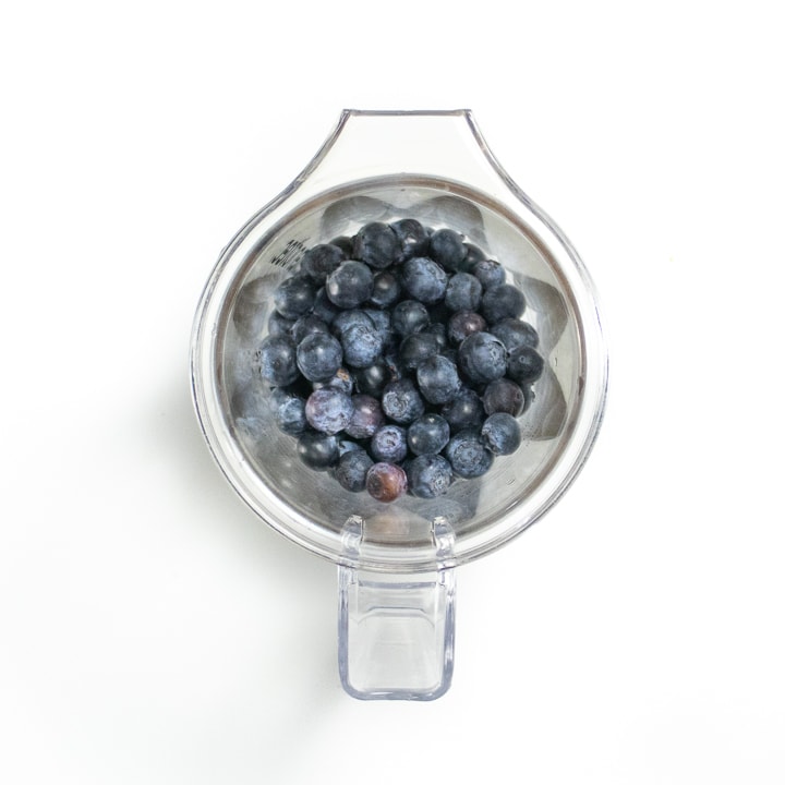 blender full of blueberries.