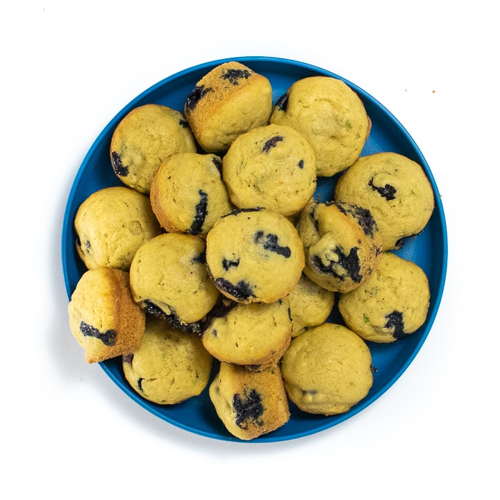 Blue kids plate with mini muffins on it. 