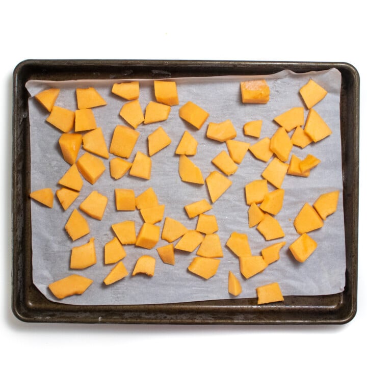 Baking sheet with frozen cantaloupe.