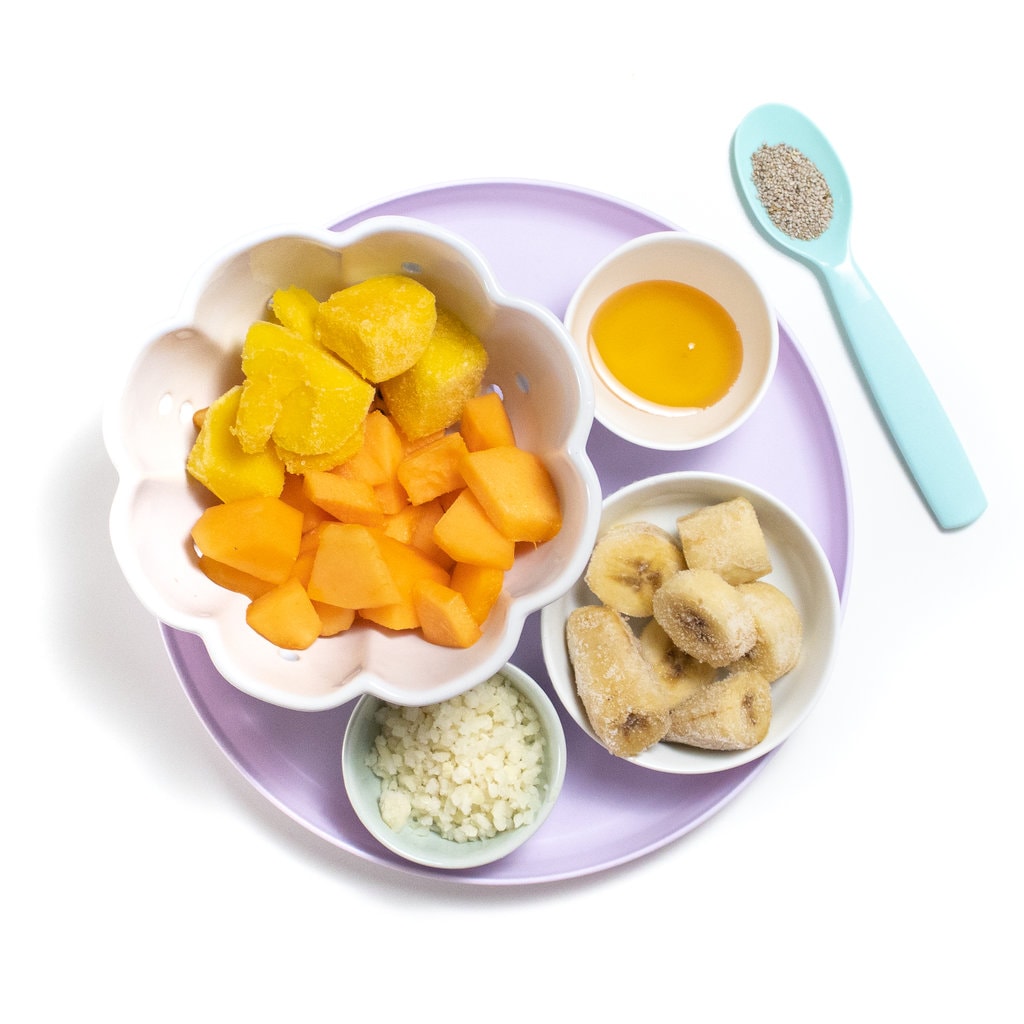 A purple plate with the ingredients for cantaloupe smoothie for baby toddler and kids,