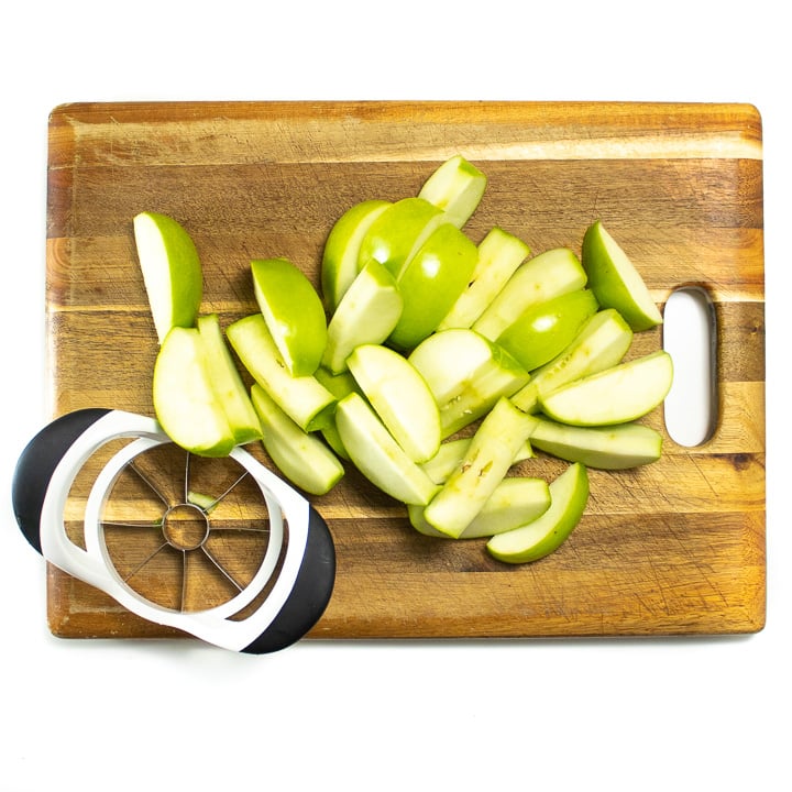 cutting board with apple slices on it. 