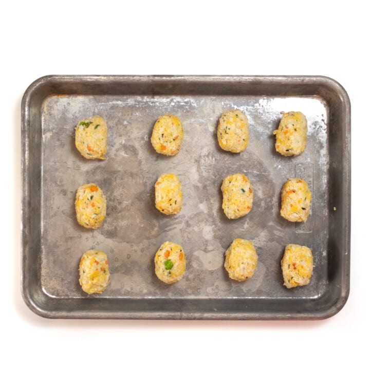 Cauliflower tots on a baking sheet.