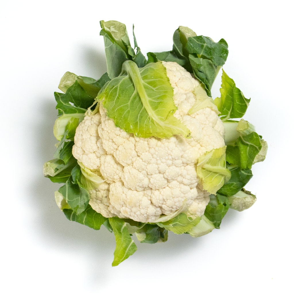 A head of cauliflower against a white background.