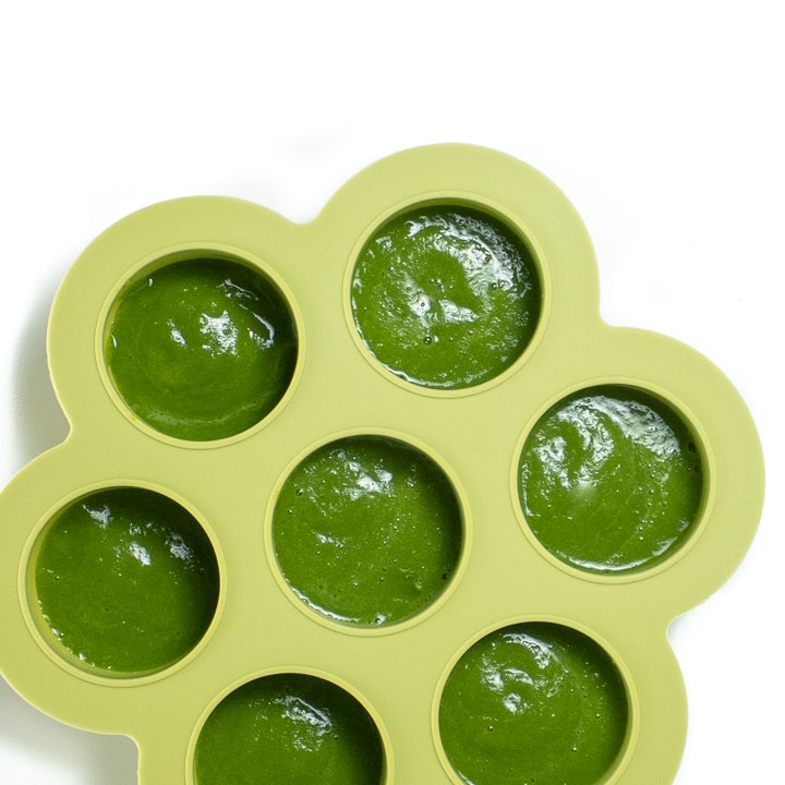 Green bean puree in a freezer container.