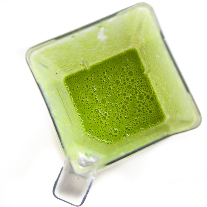 Green smoothie popsicles in a blender all blended up.