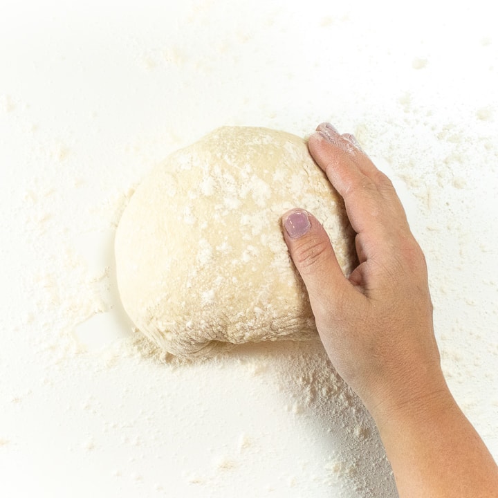 Pizza dough in a ball.