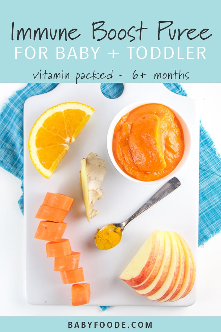 A bowl of immune boost puree surrounded by carrots, apple, orange, ginger, and turmeric on a cutting board.