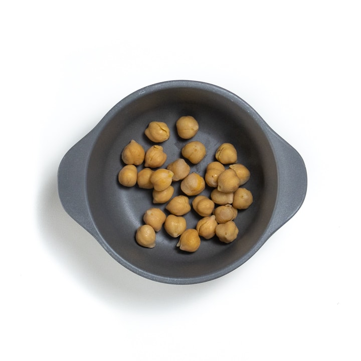 Gray bowl filled with chickpeas.