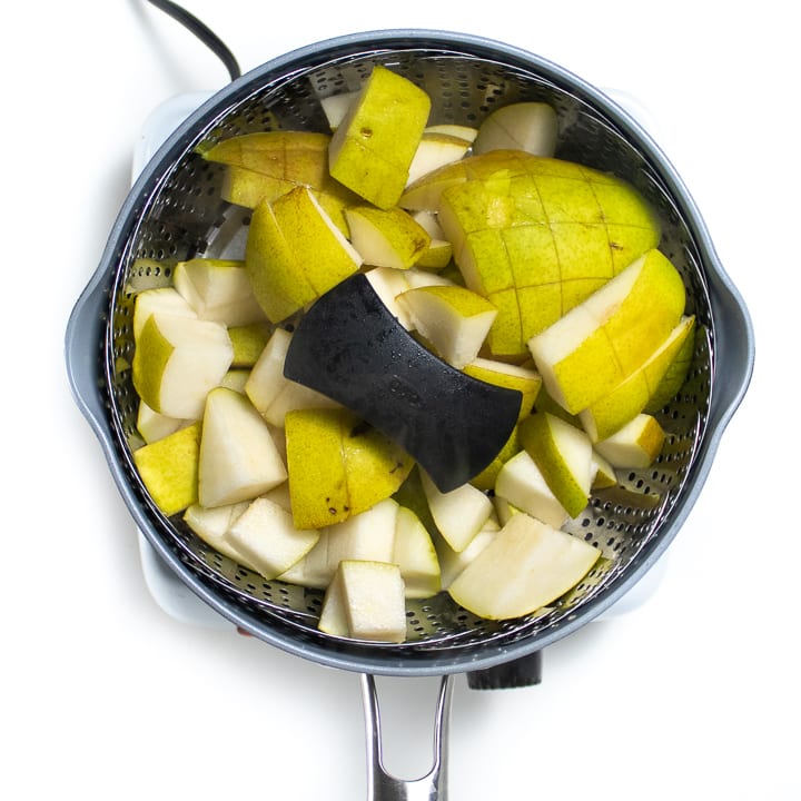 Steamer basket with pears.