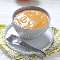 Small gray bowl filled with homemade baby food puree.