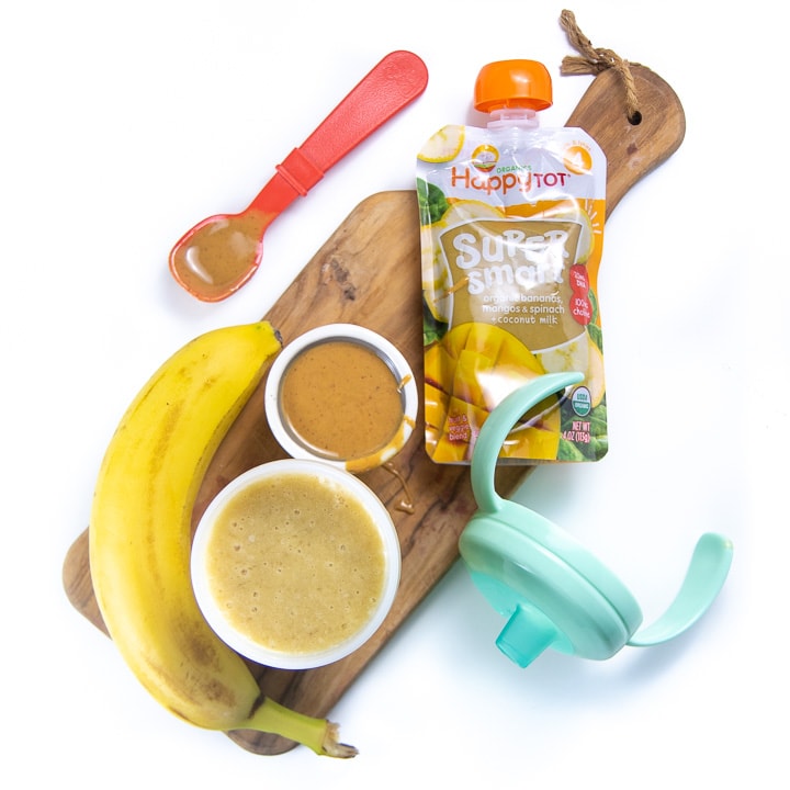 Cutting board with healthy ingredients to make smoothie for baby.