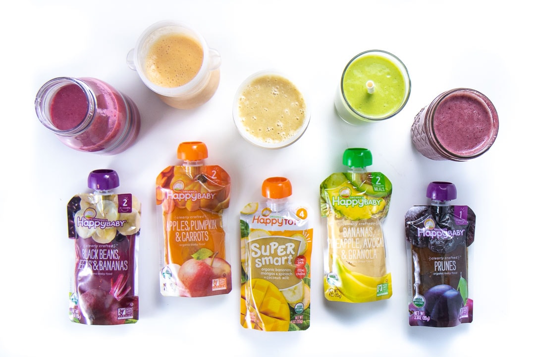 5 colorful smoothies lined up with the baby food pouches that I used to make them. 