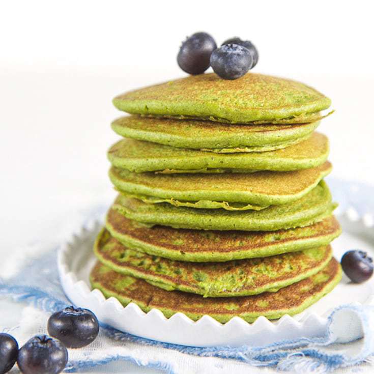 Stack of green pancakes for toddler and kids