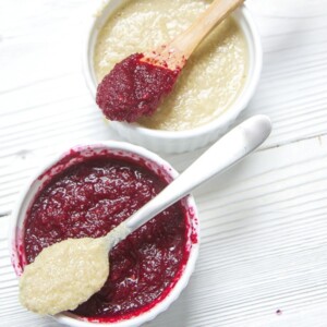 2 small white bowls full of summer baby food purees.