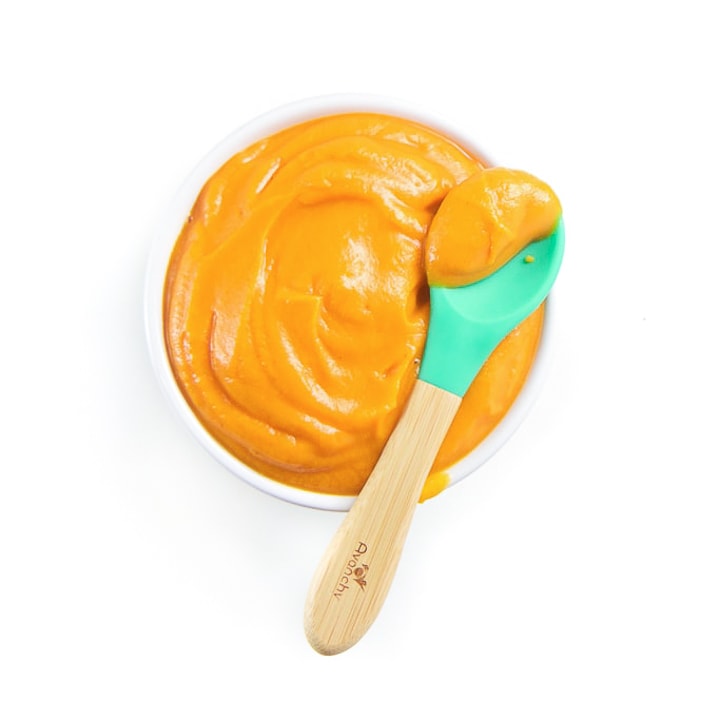 A bowl full of sweet potato puree for baby.