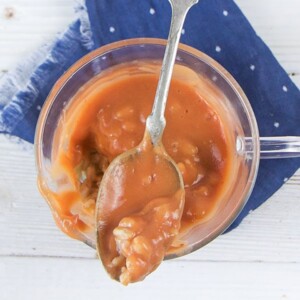 Clear jar will chunky strawberry Farro baby puree.