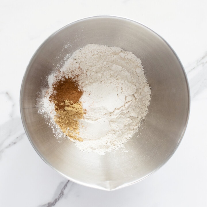 Silver mixing bowl with dry ingredients for muffins.